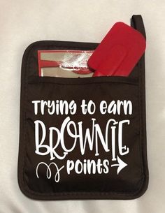 a black pouch with white writing that says trying to earn brownie points on it