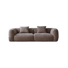 a gray couch sitting on top of a white wall