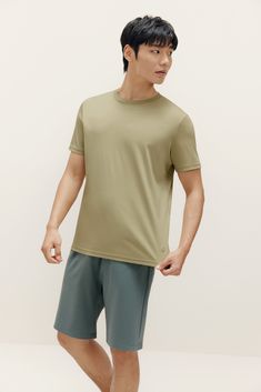 Lounge around or hit the town with our versatile Basic Short Sleeved T-Shirt, our take on a timeless classic with the perfect balance of polish and ease. | NEIWAI Basic Short Sleeved T-Shirt In Green Cotton, Size Medium | Lightweight | Versatile | Timeless Classic | Staple | Breathable Crew Neck Tshirt, Basic Shorts, Green Cotton, Smooth Texture, Men's Collection, Timeless Classic, White Cotton, Casual Shorts, Lounge