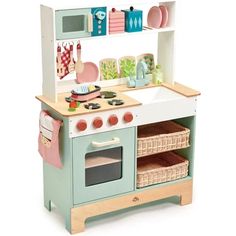 a child's wooden play kitchen with various accessories