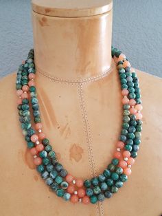 "Featuring this Triple Strand beaded necklace made using Sterling Silver Finding and hook clasp and round gemstones. The gemstones are Green with a White Matrix Jasper and Pinkish Orange Rose Quartz and are strung onto wire. The necklace has a cascading bib with 3 layers. The gemstones are cold to the touch are considered Semi-Precious Stones. The color combination is so appealing to the eye and would match just about any outfit. The necklace is heavy and constructed very sturdy. I believe that Jean Art, 3 Layer Necklace, Nice Necklaces, Pinkish Orange, Multi Strand Beaded Necklace, Lucite Jewelry, Green Jasper, Stone Beaded Necklace, Bold Jewelry