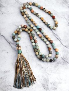 Product : 1x 108 Bead Tassels Necklace Mala Necklace High End Necklace  Material: Jasper, Agate, Alloy, Threads  boho Handmade Size: 41 inches approx. weight:120g Welcome to our Small handmade business where we craft exquisite jasper bracelets and necklace's with love and attention to detail.  When you shop with us your not only supporting a small business, but also investing in a wearable work of Art. Our jasper pieces make meaningful gifts for loved ones or cherished additions to your own jewellery collection. Spiritual Tassel Necklace With 108 Round Beads, Adjustable Spiritual Tassel Necklace For Festivals, Bohemian Hand Knotted Agate Jewelry, Bohemian Hand-knotted Agate Jewelry, Hippie Jewelry With 108 Beads For Meditation, Adjustable Spiritual Tassel Necklace With Natural Stones, Bohemian Agate Mala With Gemstone Beads, Bohemian Hand Knotted Healing Jewelry, Bohemian Hand Knotted Jewelry For Healing