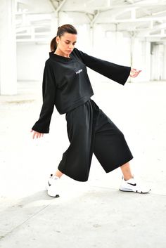 "Streetwear Outfit, Black Sweatsuit, Women Sweatshirt ◈ Stylish and chic fashion is our shared dream! You can be sure that this piece is made with a lot of love and craftsmanship. ◈ S I Z I N G ◈ The model wears size S. This item is available from XS to 4XL. Please, have a look at my Size Chart below before placing your order. The model in the picture is 63'' (160 cm) tall. ◈ D E L I V E R Y ◈ This item will be shipped in up to 5 days after your order was placed. We use Express worldwide shippin Black Stretch Hooded Tracksuit, Black Stretch Sweatpants With Ribbed Cuffs, Black Loungewear Sets For Winter, Black Loungewear Sets For Fall, Black Sets For Fall Loungewear, Black Pants With Ribbed Cuffs For Winter, Black Winter Pants With Ribbed Cuffs, Black Long Sleeve Athleisure Tracksuit, Streetwear Tracksuit With Long Sleeves And Elastic Cuffs