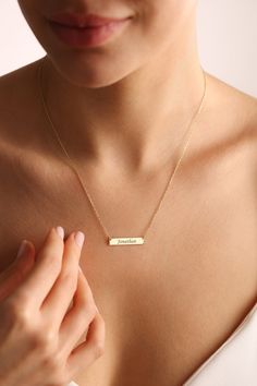 "Gold bar necklaces are elegant and tiny personalized bar necklace on a stunning dainty chain. Customize with your choice of engraved initials, names, number, dates and more. Custom name necklaces are unique personalized gifts that you can give to your loved ones.  Also dainty bar necklaces, initial necklaces are going to look stunning on you! ✨ Great gift idea for mom necklace gifts, valentines gifts, anniversary gift, birthday gifts, Christmas gifts and more. ✋ All our jewelry is %100 custom made by hand with Love and Care in our workshop! ✨ All our products High Quality Solid 925 Sterling Silver  Nickel Free High Quality Materials Standard Deliver in 6-9 Business Days Name size - lowercase letters are approximately 4 mm and uppercase letters are approximately 6 mm. *How to customize Ord Minimalist Rectangular Name Necklace For Gifts, Minimalist Rectangular Name Necklace As Gift, Minimalist Nameplate Necklace, Minimalist Custom Name Necklace, Minimalist Personalized Name Necklace With Rectangular Pendant, Dainty Rectangular Bar Necklace As Gift, Minimalist Engraved Bar Necklace For Gift, Minimalist Personalized Bar Necklace For Gift, Personalized Minimalist Bar Necklace For Gift