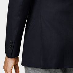 This tailored navy blazer features a relaxed shoulder, classic notch lapel, and flap pockets for a versatile, all-occasion appeal. Navy Business Blazer With Pockets, Luxury Navy Blazer With Welt Pockets, Navy Office Blazer With Pockets, Navy Blazer With Pockets For Tailoring, Navy Business Casual Blazer With Pockets, Navy Blazer With Pockets For Business Casual, Luxury Navy Blazer For Work, Navy Outerwear With Double Button Closure And Suit Collar, Luxury Navy Sport Coat For Business Casual