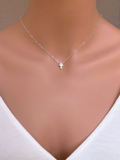 "Sterling Silver Cross Bead. A simple and classic cross shaped bead made in solid sterling silver. String this petite bead onto a finished chain for an easy and sweet necklace. The model is wearing 16\", please note the necklace length can be slightly different depend on your weight and high... Use for everyday and comfort wearing... It made of ... -9x2mm Sterling Silver Cross bead pendent attaches onto  -Sterling silver  chain14\",  16\" or 18\" or 20\" end to end spring claw, -it come with sma Tiny Cross Necklace, Dainty Cross Necklace, South San Francisco, Silver Cross Necklace, Christian Gifts For Women, Sterling Silver Cross Necklace, Tiny Cross, Sweet Necklace, Faith Gifts