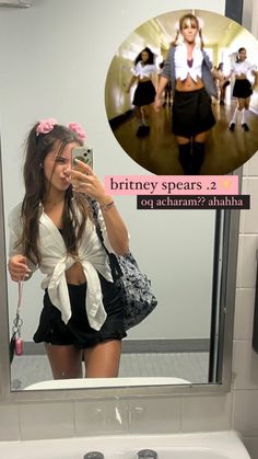 a woman taking a selfie in front of a bathroom mirror with the caption, briney spears 2 od acham??????????????????????????????