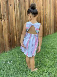 We are ready to bring in spring ! This adorable coral striped dress features an open back. Perfect for transitioning to the warmer months. Sleeveless Dress With Smocked Back For Playdate, Striped Dress With Smocked Back For Vacation, Striped Vacation Dress With Smocked Back, Striped Sleeveless Dress With Tie Back, Playful Striped Dresses For Playdate, Playful Striped Dress For Playdate, Striped Summer Dresses For Playdate, Striped Dresses For Summer Playdate, Striped Sundress For Spring