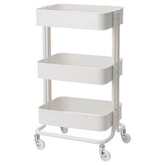 a white shelf with two shelves on wheels