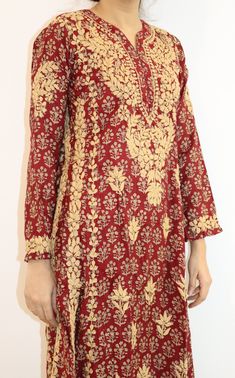 Introducing our beautiful Navya A-line Kurta. Crafted with precision, this kurta features two kali panels that create a graceful silhouette. The entire ensemble is adorned with stunning contrast gold Chikankari embroidery, adding a touch of opulence to every detail. Designed for both sophistication and comfort, this kurta boasts an A-line shape that drapes gracefully, flattering every figure. The intricate Chikankari embroidery in gold thread showcases the artistry and craftsmanship that goes into creating this masterpiece. Embrace the richness of tradition in a contemporary form as you step out in this mesmerizing ensemble. Length - 48 inches Sizes -  S - fits bust 34 M - fits bust 36 L - fits bust 38 XL - fits bust 40 0X - fits bust 42 1X - fits bust 44 Machine wash cold. Line dry, Light Silk Kurta With Resham Embroidery For Diwali, Silk Palazzo Set With Gold Embroidery For Eid, Gold Embroidered Raw Silk Palazzo Set, Silk Sherwani With Chikankari Embroidery For Navratri, Traditional Palazzo Set With Gold Embroidery For Festivals, Traditional Gold Embroidery Palazzo Set For Festive, Eid Palazzo Set With Gold Embroidery And Straight Kurta, Traditional Palazzo Set With Gold Embroidery For Eid, Traditional Gold Embroidery Palazzo Set For Festive Occasions