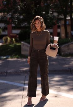 Comfy yet stylish, our Dark Olive Corduroy Cargo Pant has a high-waisted design with button and zipper closure, cargo pockets, and straight legs for an edgy look. Made of soft, stretchy corduroy, it's perfect for elevating your fall wardrobe. Ideal for a casual autumn weekend. Fabric 97% Cotton 3% Spandex Hand wash cold. Fashion Relaxed Outfit Ideas, Powerful Style Women, Streetwear Fashion Office, Business Casual Closet Capsule Wardrobe, Classy Fashion Casual, Corduroy Work Outfit, Corduroy Fall Outfit, Womens Fall Style 2024, Anthropologie Mom Style