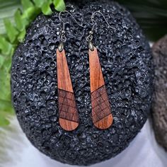 The Ulana earrings are more than just accessories; they are a tribute to the enduring art of Hawaiian weaving and a beautiful reminder of the connections we share. Features: MADE IN HAWAII Material: Genuine Hawaiian Koa wood Design: Lightweight and elegant 3D design, inspired by traditional Hawaiian weaving Finish: Smooth and polished to accentuate the wood's natural luster Dimensions: 2" x 1/2" Hook Material: the earring pendants are made of quality hygienic alloy Each pair of "Ulana" earrings, Wooden Earrings For Gift, Natural Wood Earrings As A Gift, Wooden Teardrop Earrings As Gift, Natural Wood Earrings For Gifts, Natural Wood Earrings Perfect For Gifts, Artisan Wood Handmade Earrings, Handmade Wooden Drop Earrings, Wooden Teardrop Earrings For Gift, Teardrop Wooden Earrings For Gifts