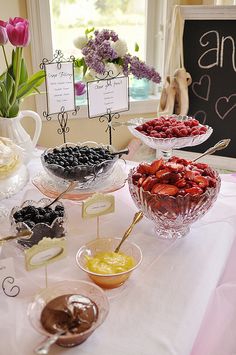 a table topped with lots of different types of desserts