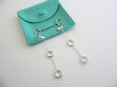 Overview:Offered for sale is a gorgeous and very rare pair of Tiffany and Co. Picasso Silver & Rock Crystal Triple Drop Dangling earrings. This pair is classic and elegant, and looks very pretty when worn. Extremely versatile and comfortable piece! Great pair to wear for work, a night in town, at a party, or just going to dinner with friends in jeans or a pretty dress. The style is classic Tiffany, making it a piece that you will most certainly use over and over again. No longer in productio Designer Dangle Earrings For Gift, Designer Dangle Earrings For Formal Occasions, Designer Dangle Earrings For Formal Events, Elegant Sterling Silver Linear Earrings With Polished Finish, Timeless Sterling Silver Linear Earrings As A Gift, Timeless Sterling Silver Linear Earrings For Gift, Luxury Rectangular Earrings For Evening, Luxury Sterling Silver Linear Earrings For Evening, Luxury Sterling Silver Rectangular Earrings