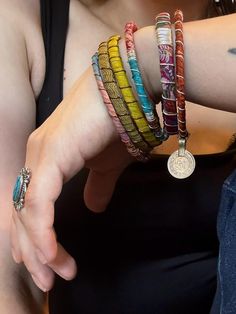 Stack up on these colorful & bold boho bangles!  I wrap each bracelet by hand with unique upcycled sari silk and finish with a wire wrap to secure.  Add vintage kuchi coin charms to a few or all to complete the look, These bracelets are a super simple and lightweight for easy, comfortable wear. Select one or mix and match to create your own personalized set! ★ Handmade ★ Upcycled Sari Silk ★ Non-Tarnish Wire ★ Vintage Kuchi Coin Charm ★ 65mm inner diameter ✉ Message for Custom Requests ✈ Free Sh Adjustable Multicolor Spiritual Cuff Bracelet, Colorful Festival Bracelets, Multicolored Handwoven Bohemian Jewelry, Colorful Handwoven Bohemian Jewelry, Colorful Bohemian Handwoven Jewelry, Adjustable Multicolor Spiritual Bangle, Colorful Bohemian Bracelets For Festival, Multicolor Hand Wrapped Hippie Wrap Bracelet, Bohemian Multicolor Hand Wrapped Jewelry