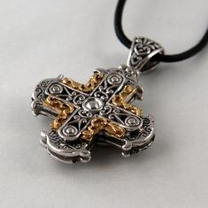 Our cross Sphere is influenced by Byzantine culture and therefore rich in ornaments. It is handmade in silver and 18 k gold, the dimensions are 3,0 cm in width, 3,0 cm in height. Height including the loop is 4,5 cm. Our pendants and crosses don't come with a chain. Luxury White Gold Cross Necklace, Luxury Silver Cross Necklace For Formal Occasions, Luxury Cross Pendant Necklace, Traditional Cross Jewelry With Intricate Design, Luxury Cross Necklace For Formal Occasions, Luxury Formal Cross Necklace, Traditional Cross Pendant Large Jewelry, Formal Cross Necklace With Large Pendant, Formal Engraved Crucifix Jewelry