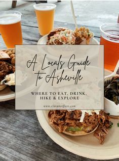 a wooden table topped with plates of food and drinks