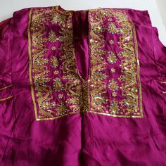 Silk, Purple, Gold , Rainbow Of Colors In This Gorgeous All Handmade Tunic , And Pants. Embroidery Of Gold, Seeded Pearls, Sequence. . Tunic Is 27" Long. X 17" Shoulders. Bottom Of The Skirt Is About 33" W. Pants 34". Elastic Waist. 13 Plus Stretch. In Excellent Condition. I Had The Top Tailored For An Event, And Worn Once. Pink Silk Kaftan With Zari Work, Pink Resham Embroidery Kaftan For Festivals, Silk Kaftan With Intricate Embroidery For Party, Pink Silk Kaftan For Festivals, Festive Silk Purple Kaftan, Festive Purple Silk Kaftan, Embroidered Pink Kaftan For Wedding, Pink Embroidered Kaftan For Wedding, Pink Zari Work Kaftan For Party