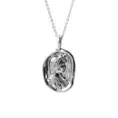 The Sappho Pendant encapsulates the spirit of the iconic ancient lyric poet, celebrated not just for her profound and passionate verses, but also for her significant role as a symbol of love and desire between women. The pendant, cast in the style of a timeless wax seal cameo, features the profile of Sappho, the 'Tenth Muse', intricately detailed and beautifully rendered in ethically sourced recycled solid gold. Sappho's name has long been synonymous with the affirmation of female homoerotic pas Elegant Coin Pendant Necklaces For Commemoration, Elegant Round Pendant Necklace For Commemoration, Symbolic Necklace With Large Pendant, Engraved Oval Pendant Jewelry, Elegant White Gold Necklace For Commemoration, Elegant Sterling Silver Necklace For Commemoration, Elegant Sterling Silver Jewelry For Commemoration, Symbolic Medallion Jewelry, Spiritual Necklaces With Polished Finish For Memorial