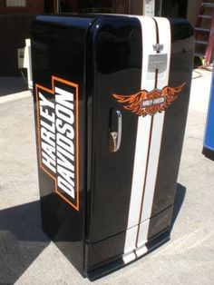 an old fashioned harley davidson refrigerator on the street