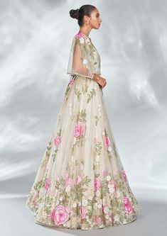 Editor's Note The multi floral gown is set in a sheer tulle base and adorned with intricate floral embroidery details and pearls on the sleeve hem. This piece is further accentuated with an exquisite pearl belt. Color: Nude Fabric: Tulle Components: Gown and belt Occasion: Reception Disclaimer: Product color may slightly vary due to photographic lighting sources or your monitor setting. Care: Dry Clean Only About the Designer Shriya Som is engaged in the design, manufacture, and distribution of Embroidered Tulle Dress In Cream, Nude Fabric, Blouse Yoke, Pearl Belt, Personal Shopping Service, Floral Gown, Embroidery Details, Photographic Lighting, Evening Wear