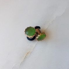 Beautiful and unique emerald colored tigers eye stone in a rose gold scallop setting. * 0g single flare in photo **available in sizes 8g-00g 3mm-10mm *I do not recommend swimming or showering in plugs. *quantity 1:1 pair *please allow 5 business days for processing time, unless rush+priority is chosen at checkout and item will be in the mail with 2 day shipping with 24-48hrs (US only) Green Tiger Eye, Tigers Eye Stone, Dangle Plugs, Stone Plugs, Earthy Jewelry, Woodland Park, Black Gems, Sister Jewelry, Black Jewel