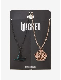 two necklaces that have been placed on top of each other in front of a card