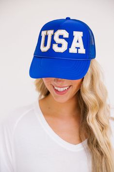 This USA hat is perfect for showing your American pride and spirit at the beach, gym, a hike, or just to cover up a bad hair day. The smiley face patch on the side is sure to put a smile on your face as well! Trucker Hat Product details: Snapback style Ponytail opening Mesh in the back of hat 100% Polyester All orders are currently shipping within 14 business days. To receive item quicker, expedited shipping is available at checkout. Blue Letter Print Trucker Hat For Beach, Fun Blue Trucker Hat With Letter Print, Blue Baseball Cap With Letter Patch And Curved Brim, Blue Baseball Cap With Letter Patch, Adjustable Blue Trucker Hat For 4th Of July, Blue Casual Baseball Cap With Letter Patch, Casual Blue Baseball Cap With Letter Patch, Casual Blue Trucker Hat For 4th Of July, Adjustable Blue Baseball Cap With Upf 50+