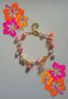 Gorgeous hibiscus bracelets, perfect for the summer! Cute Orange Bracelet, Pink And Orange Jewelry, Coral Beaded Beach Bracelets, Coral Beaded Bracelets For Beach, Bohemian Flower Bracelets For Vacation, Coral Beaded Bracelets For The Beach, Coral Beach Bracelet Jewelry, Pink Flower-shaped Jewelry For Vacation, Pink Flower Jewelry For Vacation