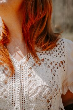 Be the life of the party in the Belize Top! This playful mesh top features delicate floral crochet details and a v-neck button down with contrast scallop elastic sleeves. Its vintage cream color and crop length add a unique touch. (Hot tip: pair with high-waisted jeans for a flirty and fun look!) Feminine Lace Top With Crochet Trim For Day Out, Spring Cropped Blouse With Lace Collar, Cropped Lace Blouse With Lace Trim For Spring, Summer Cropped Tops With Lace Collar, Cropped Lace Top With Patchwork For Spring, Cropped Lace Patchwork Top For Spring, Chic Fitted Blouse With Crochet Trim, Cropped Tops With Lace Collar For Summer, Feminine Crochet Top With Lace Trim