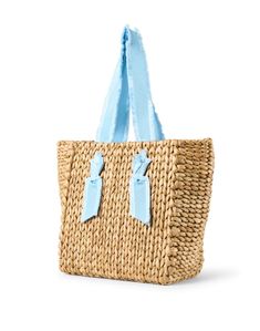 Pamela Munson's Isla Bahia tote bag is an endlessly versatile accessory you'll be carrying all season. Woven from corn husks and finished with sweet grosgrain handles, this lined carryall is just as perfect for the beach as it is for lunch with the ladies. Style it with all of your favorite casual warm weather ensembles. Blue Straw Tote Bag, Shopping Beach Tote With Rolled Handles, Rectangular Beach Bag With Rolled Handles For Shopping, Blue Top Handle Straw Bag For Shopping, Blue Top Handle Straw Bag For Everyday Use, Blue Top Handle Straw Bag For Travel, Blue Straw Tote Shoulder Bag, Beach Tote Bag With Rolled Handles For Shopping, Blue Top Handle Straw Bag For Summer