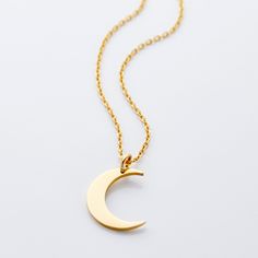 This minimalistic Crescent Moon Necklace, available here in its standard form, is a great and delicate addition to any outfit. Gentle, like the moon, this piece is a must-have piece and makes for a flawless gift! Lifetime Warranty Included on all jewelry. Cresent Moon Necklaces, Rose Gold Moon Necklace For Gift, Rose Gold Crescent Necklace With Moon Charm, Luxury Gold Moon-shaped Necklace, Gold Moon-shaped Necklace With Moon Charm, Crescent Moon Necklace Silver, Gold Moon Necklace, Vertical Bar Necklace, Crescent Necklace