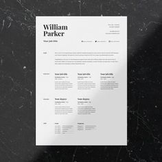 a white resume on top of a black marble counter with the words william parker above it