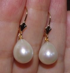 Quality japan 14k golden white 27mm tear drop cultured pearl leverback earrings being offered is a fabulous 14k 27mm large golden / white japan cultured pearls perfect tear drop white / golden pearl earrings these earrings are new old stock pearls they are from japan , quality lustorous , well matched japanese pearls are famous for being top rated quality they are new old stocks i have few pairs. plesae see photos. photos rae just the sample. let me know if you need to see a photo of what i have Formal Pear-shaped Pearl Earrings With Ear Wire, High Luster Teardrop Pearl Earrings, Classic High Luster Drop Pearl Earrings, Formal Yellow Gold Pear-shaped Pearl Earrings, Pear-shaped 14k Gold Pearl Earrings, Pear-shaped Pearl Drop Earrings, Elegant Yellow Gold Teardrop Earrings With Pearl Drop, Classic Pearl Drop Pear-shaped Earrings, Classic White Pear-shaped Pearl Earrings