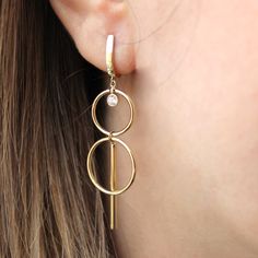 Circle Earrings made from 14k solid gold , best modern and minimalist design is created with geometric figures. High quality and All 585 gold earrings is suitable for every occasion.  Material: 14K Gold Karat: 14 Karats Gold (585) Gemstone: CZ Stone BEST CHOİCE FOR GİFT🎁 You can buy the best gifts for your loved ones from this shop with our special packaging that we use for each product. DELIVERY🚀 Your order will be crafted and ready to ship within 1 - 5 business days.We use express shipping for all orders.Please contact us if you have any urgency. Estimated delivery time: USA 1-3 days EU   1-3 days AUSTRALİA  2-7 days CANADA  2-4 days Other 2-8 days Modern 14k Gold Drop Earrings, Modern 14k Gold Dangle Jewelry, Modern 14k Gold Filled Earrings For Formal Occasions, Modern Everyday Drop Linear Earrings, Modern Yellow Gold Drop Earrings, Modern Gold Plated Linear Earrings, Modern 14k Gold Filled Linear Earrings Gift, Modern Gold-plated Linear Earrings, Modern Gold Plated Hoop Earrings