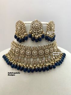 Antique Gold Polki Necklace Set comes with Stud earrings and tikka / Indian Jewelry/ High Quality Kundan and Polki Jewelry/ Bollywood Jewelry/Wedding Jewelry/Navy Blue  All items are shipped from Brampton, Ontario, Canada. If you need your item by a certain day, please reach out to us for express delivery option before placing the order so that we can update the shipping for you. Standard shipping/delivery timeline Below are the delivery timeline estimates once the order ia shipped ---> USA delivery timeline * 3-5 business days to major urban centers in USA. It may take 1-2 days extra to remote locations ---> Canada delivery timeline  * 2-3 business days - GTA  & Montreal  * 2-4  business days - Rest of Ontario/Quebec * 3-6 business days-  Rest of Canada    ---> Europe/Middle East timeline Bollywood Blue Bridal Necklace Hand Set, Blue Hand-set Kundan Necklace For Weddings, Blue Hand Set Kundan Necklace For Wedding, Blue Hand-set Bridal Necklace For Celebration, Blue Hand Set Bridal Necklace For Celebration, Blue Bridal Necklace Hand Set For Celebrations, Blue Meenakari Bridal Necklace For Wedding, Celebration Blue Bridal Necklace Hand Set, Party Jewelry With Zari Work For Festivals