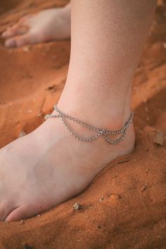 The most gorgeous and unique anklet! This anklet features a super romantic scallop design, and is made of a solid stainless steel chain that is completely tarnish proof and waterproof so you can wear it in the pool, ocean, shower, etc... This anklet has an adjustable chain that moves between 9.5-10.2 inches in length. **Please note that this anklet is running on the large side. It should still fit most adult women, but we recommend measuring beforehand to be sure of your fit!** Silver Adjustable Chain Anklet, Beach Anklets With Adjustable Metal Chain, Silver Adjustable Chain Metal Anklet, Silver Adjustable Chain Anklets In Metal, Silver Anklets With Adjustable Chain, Festival Anklets With Adjustable Length, Adjustable Metal Anklets Nickel Free, Adjustable Metal Anklets For Summer, Festival Adjustable Anklets