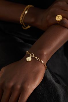 Foundrae's modern heirloom pieces are created to tell a story, starting with the meaning behind each design. Handcrafted from 18-karat gold, the 'Spade' pendant on this bracelet represents joy and abundance. It's set with a sparkling diamond at the center and hangs from the brand's 'Classic FOB Clip Chain'. Luxury Engraved Diamond Bracelet As Gift, Luxury Engraved Diamond Bracelet Gift, Modern Engraved Yellow Gold Bracelets, Luxury Sterling Silver Charm Bracelet For Formal Occasions, Luxury Charm Bracelet With 17 Jewels For Gift, Timeless Gold-tone Bracelet As Gift, Timeless Polished Chain Bracelet As Gift, Timeless Gold-tone Bracelet For Gift, Timeless Gold Bracelet With Polished Finish