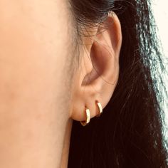 These simple, minimalist solid round hoop earrings are made of solid 925 sterling silver, highly polished for a great shine with a 18k gold plate to create luxury look.The hoop earrings ear huggies come in different inner diameter: 6 mm, 7 mm, 8 mm, 9 mm that can be fit on different position such as 2nd and 3nd ear lobs or tragus, cartilages. Hoop design make them comfortable to wear everyday even at night. Jewelry Care: See more information about how to care for your jewelry here. Shipping Policy: Orders will be shipped within 1-3 business days. Economy shipping will take 7-14 days to arrive and standard shipping is 1- 4 days for U.S. orders. International shipping time is depended on the country and per shipping method. Shipping cost will be calculated at check out.For more details, see Ear Huggies, Night Jewelry, Luxury Look, Hoop Design, Earrings Ear, Fine Jewelry Gift, Simple Earrings, Silver Hoops, Silver Hoop Earrings