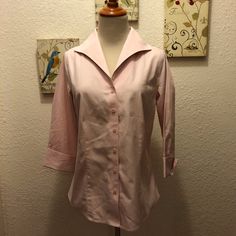 This Coldwater Creek Button Down Blouse Is A 1950’s Lady’s Dream! The Large Collar Is Bolstered By A Stiff Under Collar, And The Neckline Comes To A V. The Sleeves Are 3/4 In Length And Have A Retro Cuff. The Blush Pink Goes With Any Complexion And Completes Any Retro Outfit. Looks To Be Brand New- No Signs Of Wear At All. Marked An Xs (4) Fits More Like A S Bust: 34” Waist: Does Not Nip In Length: 23” Shoulders: (A Little Wide) 17” 100% Crisp Cotton. No Flaws To Note. Smoke/Pet Free Home. Spring Fitted Half Sleeve Shirt, Fitted Half Sleeve Spring Shirt, Pink 3/4 Sleeve Top For Work, Fitted Half Sleeve Shirt For Spring, Retro Pink Button-up Blouse, Feminine Workwear Blouse With 3/4 Sleeves, Chic 3/4 Sleeve Blouse With Buttons, Feminine Blouse With 3/4 Sleeve For Workwear, Chic Blouse With 3/4 Sleeves And Buttons