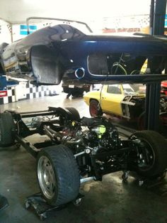 an image of a car being worked on in a garage