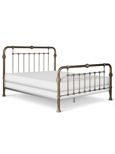 an antique style metal bed frame with white sheets and gold colored headboard, against a white background