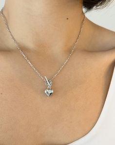 Edgy Aesthetic x Romantic Vibe = This 3D chrome heart necklace. Wear alone or stack it up for an even more unique look. Pair it with the matching bracelet for the perfect set. Details: Metal: Sterling Silver with Rhodium Plating & Anti-Tarnish Coating Pendant: 10.79 x 11.60mm Length: 17" Chain Toggle Clasp Silver Stainless Steel Charm Necklace With Heart Charm, Silver Stainless Steel Charm Necklace With Heart, Silver Tarnish-resistant Heart Necklace For Everyday, Silver Double Heart Necklace Tarnish Resistant, Silver Double Heart Tarnish Resistant Jewelry, Silver Double Heart Jewelry With Chain, Silver Toggle Necklace With Charms For Gifts, Silver Tarnish Resistant Double Heart Jewelry, Silver Tarnish-resistant Double Heart Jewelry