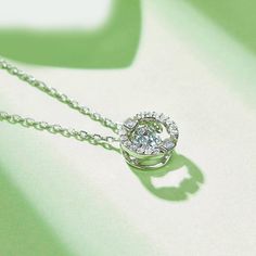 An eye-catching round moissanite dances with ease at the center of this appealing women's necklace, expressing your unstoppable love. Additional round gem set in sterling silver frame the center. Features Moissanite was originally found in meteorites(Chemical name: Silicon Carbide). It was first discovered in 1893, while a scientist was examining meteor samples from a crater in Arizona. After many years, the experts has been recreated moissanite in the laboratory, that make the gemstone with fri Pave Necklace, Women's Necklace, Silicon Carbide, Moissanite Necklace, Stone Material, Moissanite Jewelry, Round Moissanite, Timeless Jewelry, Silver Frame