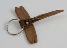 a brown leather keychain with a metal ring