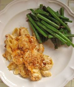 green beans and pasta on a white plate