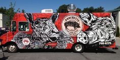 a man standing next to a food truck with an animal painted on it's side