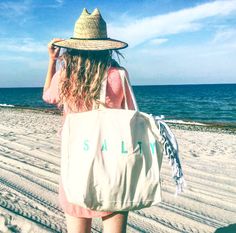 "The SALTY Oversized canvas tote bag is perfect for a trip to the beach! Also perfect to use as a reusable shopping bag, or everyday carryall. Available with text in several colors... check out the variations! This bag is made from 100% thick, sturdy canvas. AVAILABLE IN TWO SIZES * Large - 19.5\" x 13\" with a 4\" gusset *Jumbo - 23\" x 13\" with a 6\" gusset These bags are hand painted using non-toxic fabric paint. The technique used creates an attractive distressed appearance to the text that Beach Bridesmaids Gifts, Personalised Jute Bags, Large Beach Bag, Canvas Beach Tote, Perfect Beach Bag, Minimalist Tote Bag, Pool Bag, Minimalist Tote, Accessories Beach