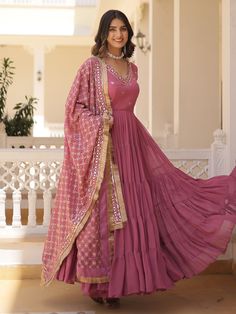 our stunning pink georgette gown, adorned with intricate embroidery and shimmering sequin work. This enchanting ensemble is designed to make you feel like a princess, radiating elegance and charm at every turn.
Available in fully stitched sizes ranging from XS to XXL, this gown ensures a perfect fit for women of all body types. With a generous 15-meter flair and a length of 56 inches, it boasts a graceful silhouette that will captivate hearts wherever you go.
Accompanying this beautiful gown is Engagement Gown, Lehenga Crop Top, Georgette Gown, Floral Lehenga, Lehenga Choli Wedding, Party Wear Lehenga Choli, Reception Gown, Bollywood Lehenga, Cocktail Wear