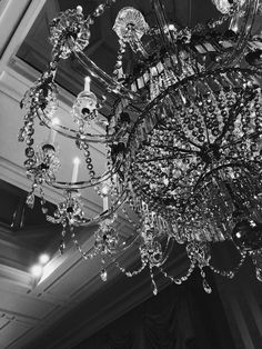 a chandelier hanging from the ceiling in a room